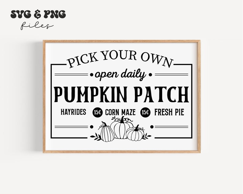 May include: A rectangular sign in a wooden frame featuring black text on a white background that reads PICK YOUR OWN open daily PUMPKIN PATCH HAYRIDES 15&cent; CORN MAZE 15&cent; FRESH PIE with a graphic illustration of three pumpkins at the bottom.