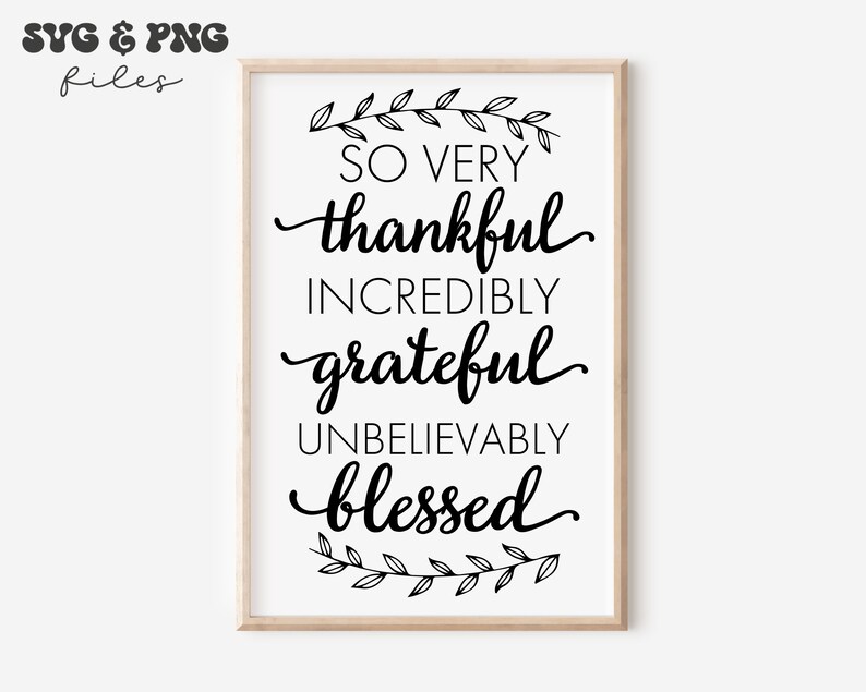 May include: A rectangular wall art print in a light wood frame featuring black text on a white background that reads: SO VERY thankful INCREDIBLY grateful UNBELIEVABLY blessed, accented by a black line-art leaf branch at the top and bottom.