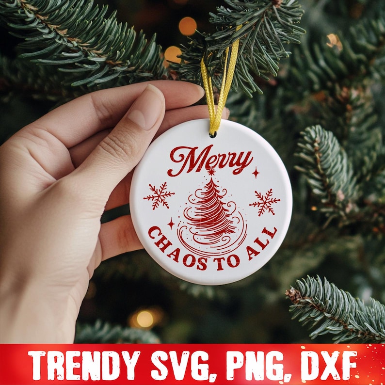 May include: White ceramic Christmas ornament with red text that reads "Merry Chaos to All" and a red stylized Christmas tree design.