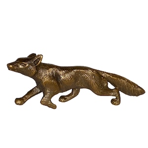 May include: A bronze figurine of a fox running, with a detailed textured surface.