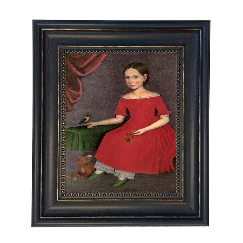 May include: Framed portrait of a young person in a red dress, seated with a bird on a table. The painting has a dark blue frame with gold accents. A teddy bear is at the person's feet.