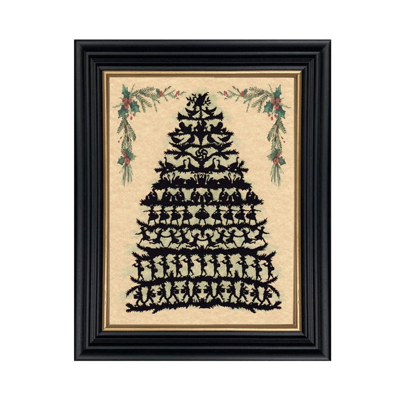 May include: A framed print of a black silhouette Christmas tree made of paper cutouts. The tree is decorated with birds, swans, and dancers. The background is a light brown with green and red accents.