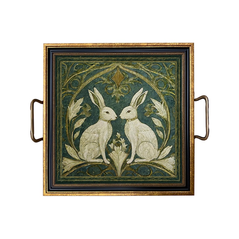 May include: A square serving tray with gold trim and two brass handles. The tray features a framed image of two white rabbits facing each other in a green and gold floral design.