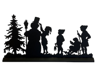 May include: Black silhouette of a snowman with a hat and broom, a Christmas tree, and four children playing in the snow. The children are wearing hats and coats. One child is pulling a sled.