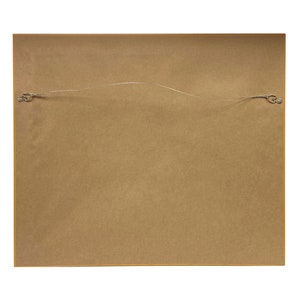 May include: The back of a framed picture with a brown cardboard backing and a wire hanging system.