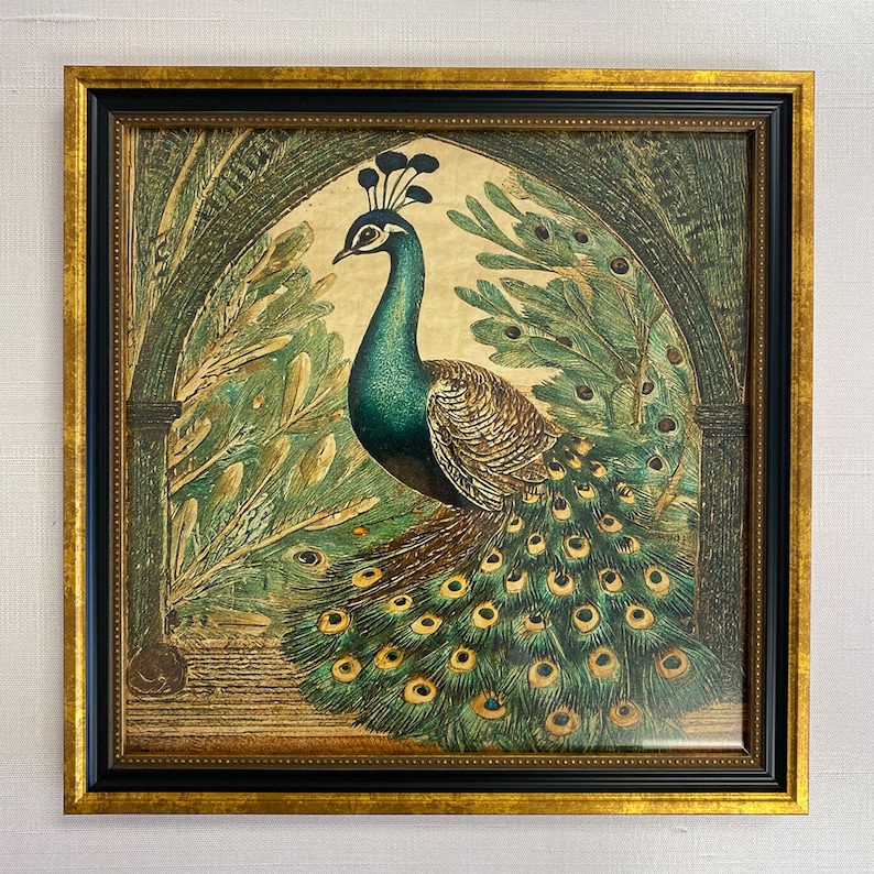 May include: A framed print of a peacock with its tail feathers spread out. The peacock is green and blue with gold accents. The background is a dark green and brown.