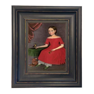 May include: Framed portrait of a young person in a red dress, seated with a small bird and a stuffed animal. The painting has a dark blue frame with gold trim, and the background is a muted purple.