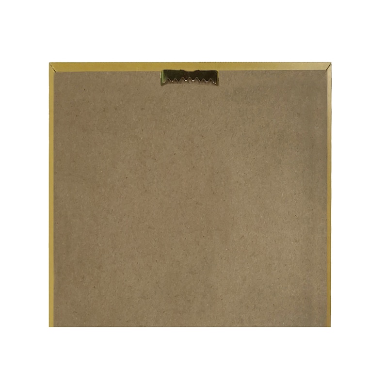 May include: The back of a framed picture with a gold frame. The frame has a sawtooth hanger on the back.