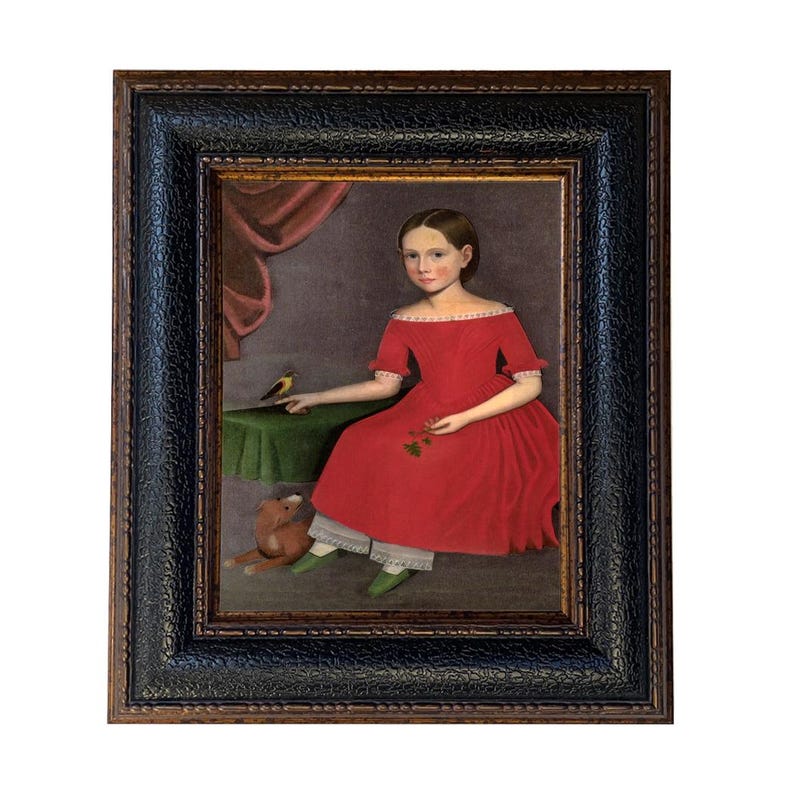 May include: A framed portrait of a young person in a red dress, seated with a small bird and a teddy bear. The painting has a dark, textured frame and a vintage aesthetic. The background features a curtain and a table.