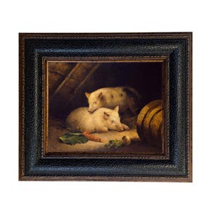 May include: A framed painting depicts two pigs in a barn setting. One pig is lying down, while the other is resting on top. A carrot and other vegetables are in the foreground. The painting is in a dark wooden frame.