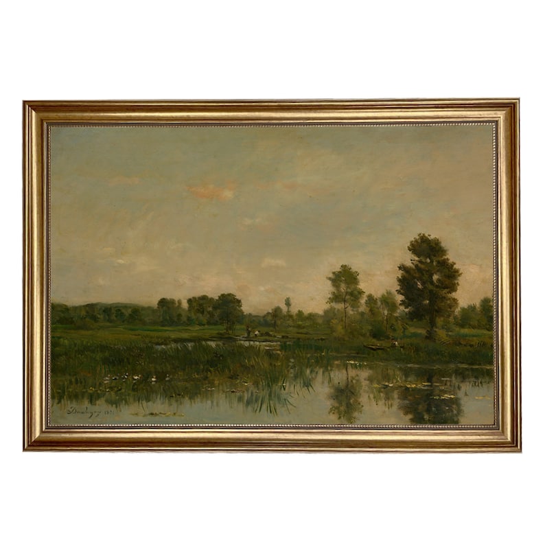 May include: A painting of a landscape with a river, trees, and a cloudy sky. The river is reflecting the sky and the trees. The painting is framed in a gold frame.