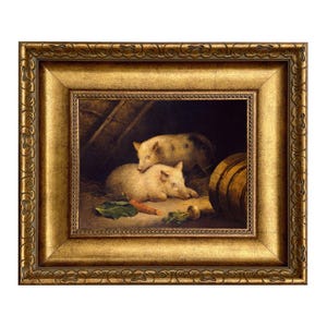 May include: A framed painting depicts two pigs resting in a barn setting. The pigs are light-colored with dark spots. A carrot and other vegetables are visible. The frame is ornate with a gold finish.