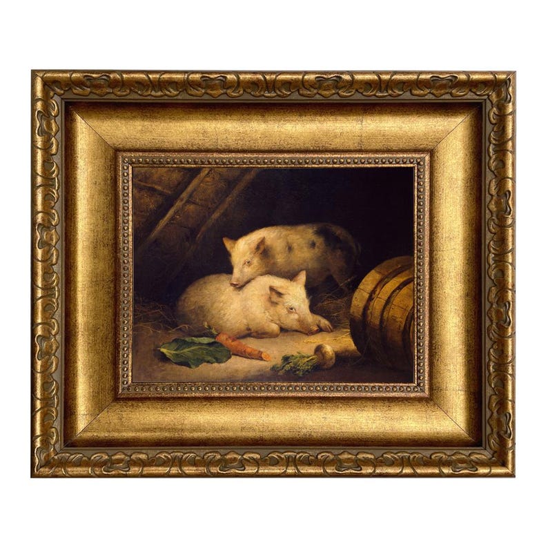 May include: A framed painting depicts two pigs resting in a barn setting. The pigs are light-colored with dark spots. A carrot and other vegetables are visible. The frame is ornate with a gold finish.