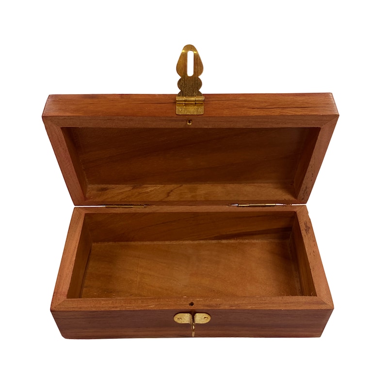 May include: A wooden box with a brass latch. The box is open and empty.