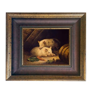 May include: A framed painting depicts two pigs in a barn setting. One pig is lying down, while the other is standing behind it. A carrot and other vegetables are in the foreground. The frame is dark brown with gold accents.