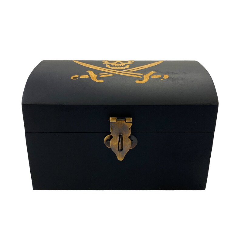 May include: Black wooden treasure chest with a gold pirate skull and crossbones design. The chest has a brass latch and hinges.