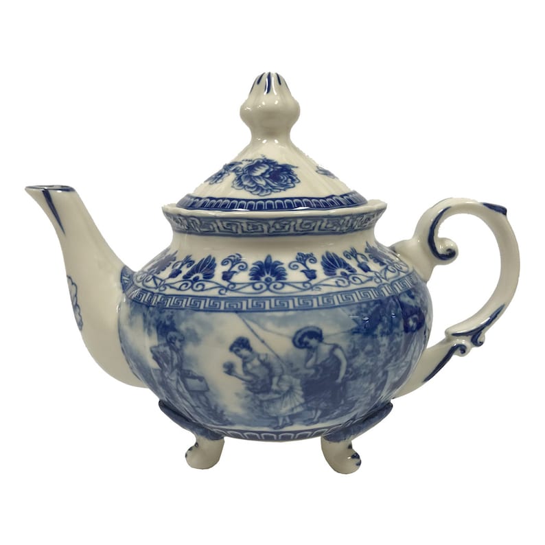 May include: A white teapot with a blue and white floral design. The teapot has a lid and a spout. The teapot is sitting on a white background.