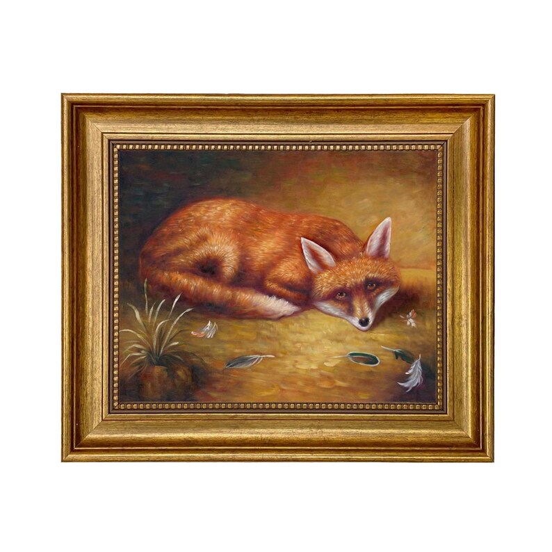 May include: A framed painting of a red fox resting on a golden-brown surface. The fox has white accents on its ears and chest. Feathers and grass are scattered around the fox. The frame is gold.