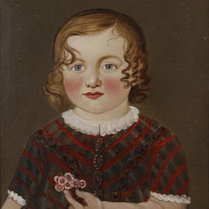 May include: A portrait of a young child with blue eyes and rosy cheeks. The child has curly brown hair and is wearing a dress with red and green stripes and a white collar. The child is holding a small bouquet of pink flowers.