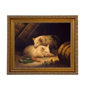 May include: An antique framed painting depicts two light-colored pigs resting in a barn setting. One pig is lying down, while the other rests on top. A carrot and greens are in the foreground. A wooden barrel is visible on the right.