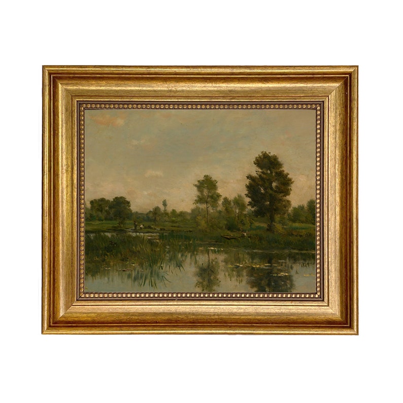 May include: A framed oil painting depicting a tranquil landscape with a lake, trees, and a cloudy sky. The painting is in a gold frame.