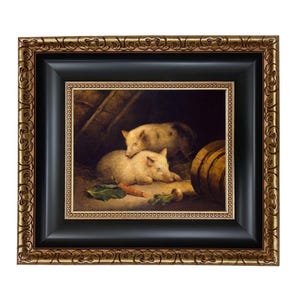 May include: Framed oil painting depicting two pigs in a barn setting. The pigs are light-colored with dark spots, resting near a carrot, turnip, and a wooden barrel. The frame is black with a gold ornate border.
