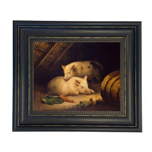 May include: Framed painting of two pigs resting in a barn. The pigs are light-colored with dark spots. A carrot, a turnip, and a green leaf are in the foreground. A wooden barrel is visible on the right side. The frame is black with a gold beaded inner edge.