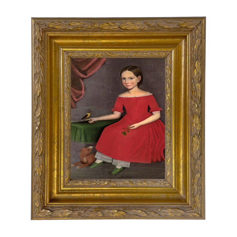 May include: A framed portrait of a young person in a red dress, seated with a small bird on a table. The painting features a gold frame with ornate detailing, a green table, and a stuffed animal at the subject's feet.