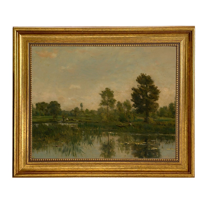 May include: A framed oil painting depicting a tranquil landscape with a lake, trees, and a cloudy sky. The lake is in the foreground, with green trees lining the banks. The sky is a pale blue with white clouds.