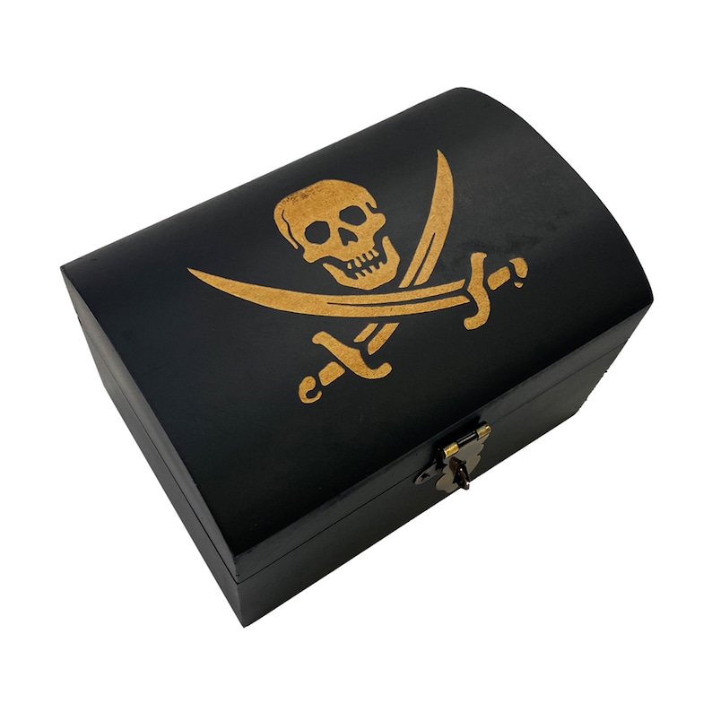 May include: A black wooden treasure chest with a gold pirate skull and crossbones design on the lid. The chest has a brass lock and hinge.
