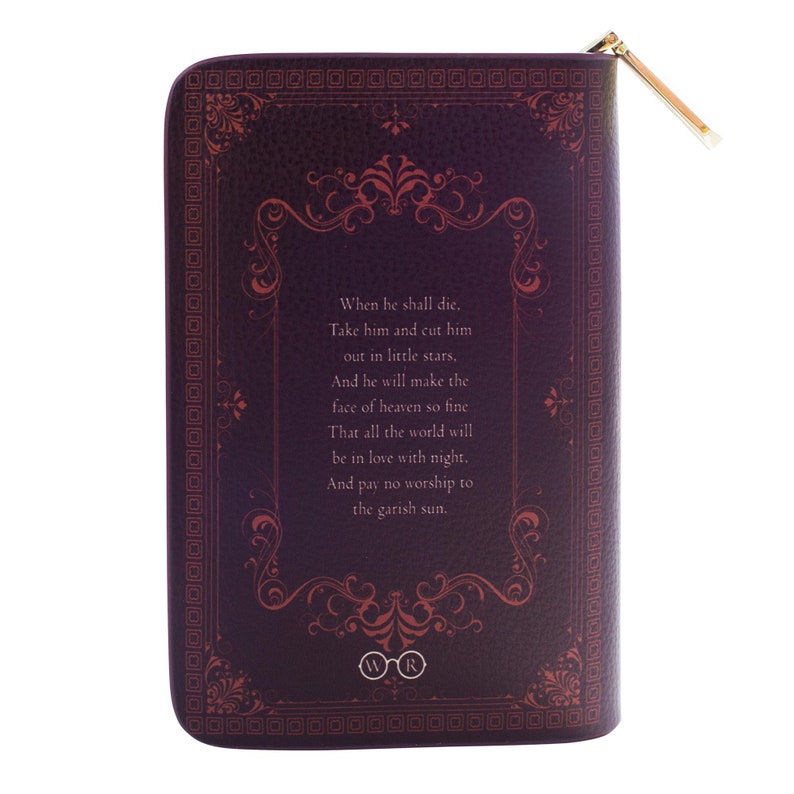 May include: A dark purple zippered pouch with a gold zip pull. The pouch has a textured leather-like appearance and features ornate red floral designs and text from a poem. The bottom of the pouch has the letters "WR" inside of a circle.