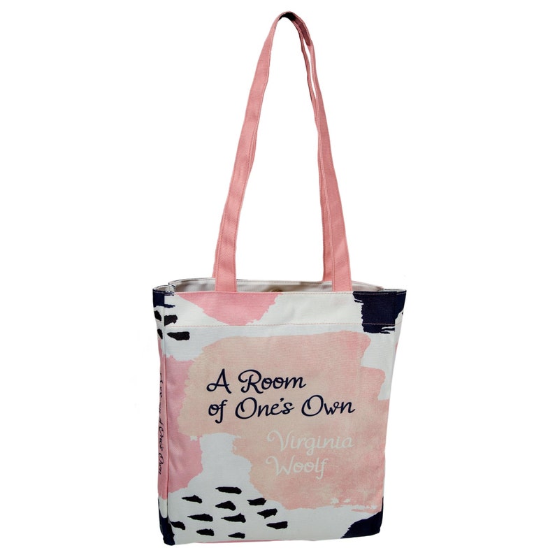 May include: A pink and white tote bag with abstract brushstrokes and black accents. The bag has a quote from Virginia Woolf's book "A Room of One's Own" printed on it.
