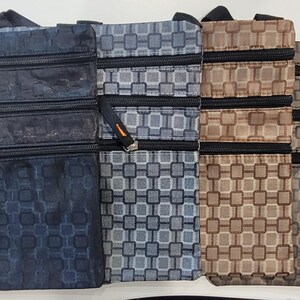 May include: Four zippered pouches with different geometric patterns. The pouches are in shades of blue, gray, brown, and beige.