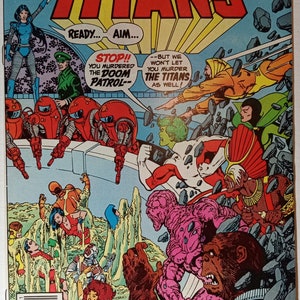May include: Comic book cover featuring the Teen Titans battling the Brotherhood of Evil. The cover art depicts the Titans in a fight scene with the Doom Patrol. The text on the cover reads "The New Teen Titans" and "Re-enter: The Brotherhood of Evil!"