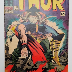 May include: Vintage comic book cover of "The Mighty Thor" #127, featuring a dynamic illustration of Thor battling a villain. The cover art is vibrant with bold colors, showcasing action and conflict. The title and issue number are prominently displayed.