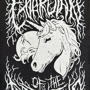 May include: Black and white embroidered patch with a unicorn head and the text "WARDUNK OF THE ARHIMOTHER (LEITZER)"