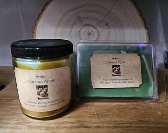 May include: A jar candle and a wax melt container with "Caramel Apple" labels. The candle is in a clear glass jar with a black lid. The wax melt is green and in a clear plastic container. The labels mention red apple, caramel, and vanilla extract.