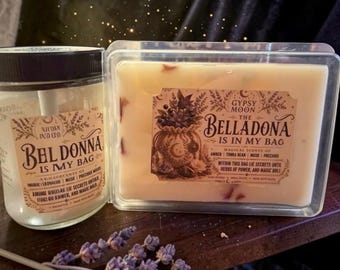 May include: A clear glass candle jar and a rectangular wax melt container, both featuring labels titled Gypsy Moon The Belladona Is In My Bag. The labels list amber, tonka bean, musk, and precious woods scents with botanical illustrations.