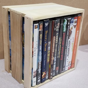 Dvd storage crate holds 12 normal sized dvd cases.