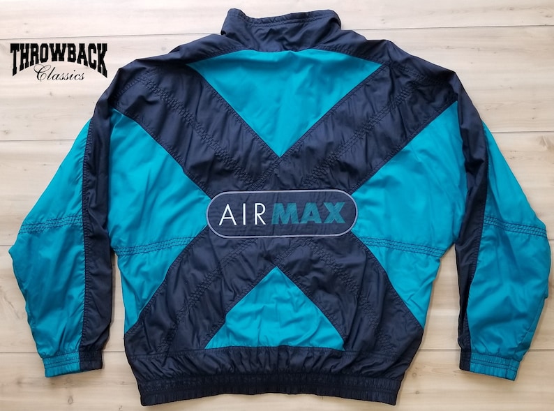May include: A blue and black windbreaker jacket with a large "AIR MAX" logo on the back.