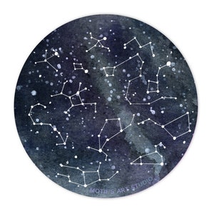 May include: A watercolor painting of a night sky with constellations in white. The background is a dark blue with white speckles. The text "MOTIF'S ART STUDIO" is in the bottom right corner.