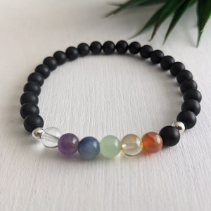 Colourful 7 chakra bracelet with 6mm semi-precious gemstone beads.