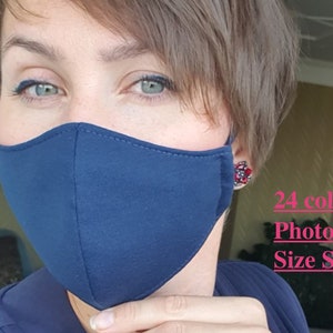 May include: A person wearing a dark blue face mask. The mask is made of fabric and has a simple design. The text "24 colors Photo Size Small" is visible in the image.
