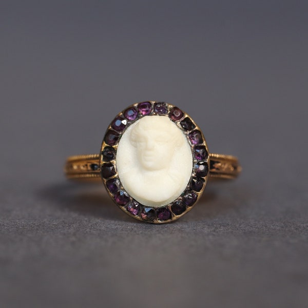 Antique Georgian era black enamel mourning ring with marble cameo and amethyst halo in 18ct gold