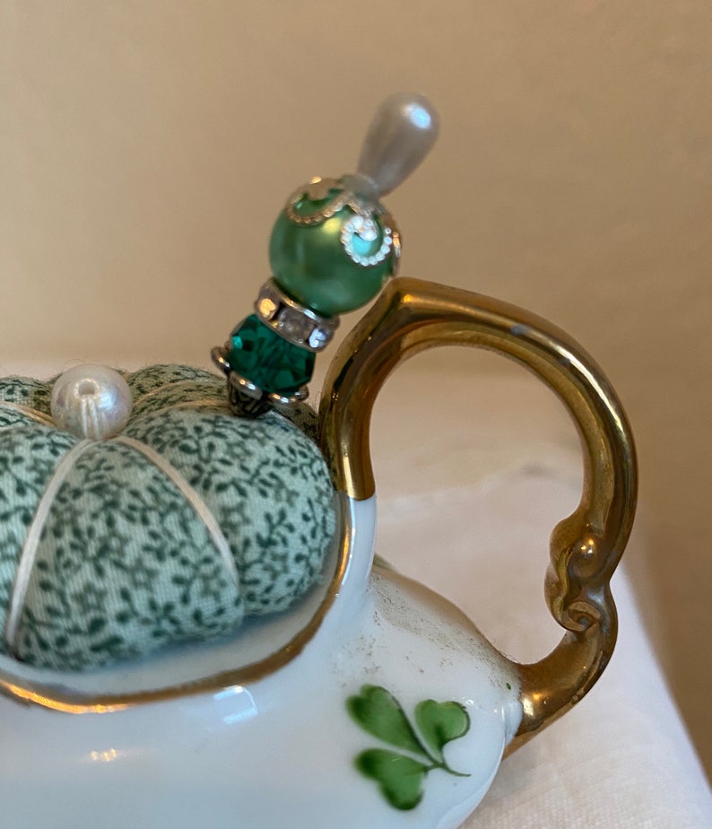 Teapot pincushion with green clovers and coordinating print