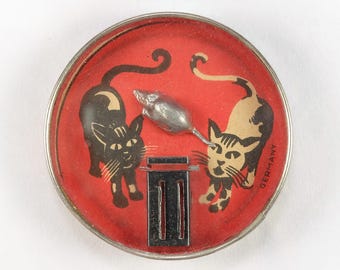Juego de destreza antiguo con gatos blancos y negros y trampa para ratones, rompecabezas de los años 20-30.
