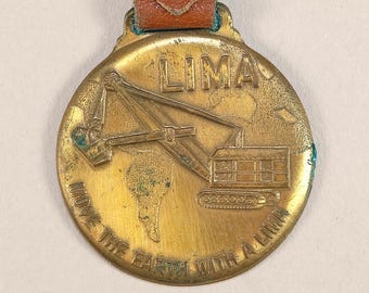Vintage LIMA Heavy Construction Equipment Advertising Pocket Watch Fob 1950s