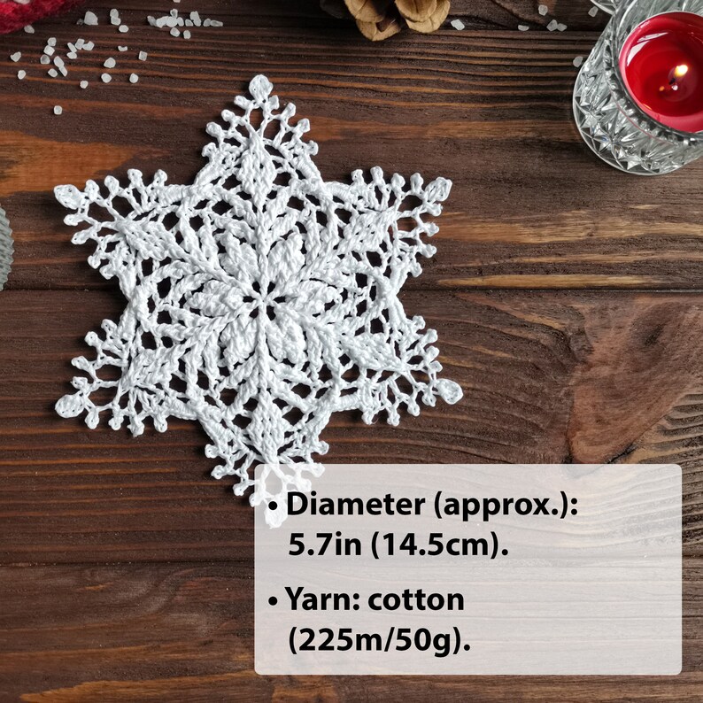 Crocheted snowflake of modern sculptural design, 5.7 inches in diameter and made with cotton yarn.