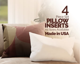May include: A set of four white pillow inserts. The text on the image reads "4 Piece Set Pillow Inserts All Sizes Available Made in USA".