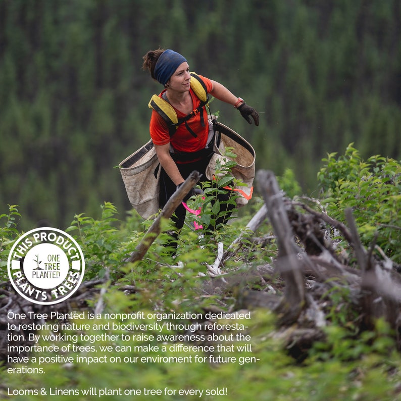 May include: A woman plants a tree in a forest. The image includes a circular logo with the text "This Product Plants Trees" and "One Tree Planted".